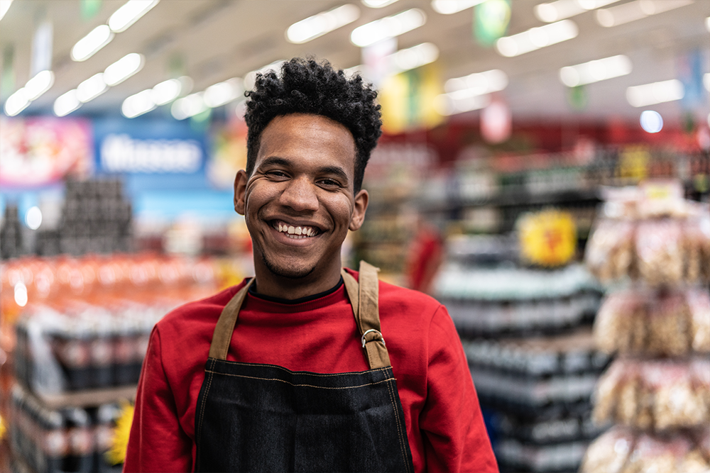 Common Cents employee working with a smile